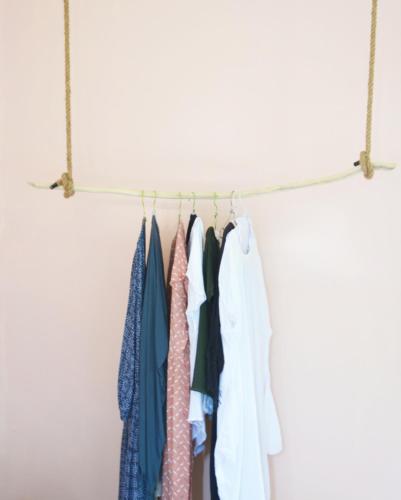 a group of clothes hanging on a clothes rack at Lambo Homestay in Waikabubak