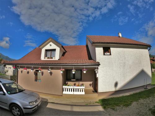 a model of a house with a car parked in front at Guest House Blue Views in Plav
