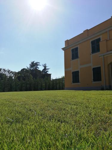 a field of grass next to a building at Santa Caterina in Levanto