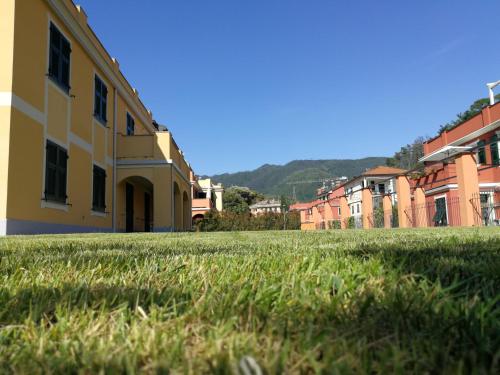 a field of grass in front of a building at Santa Caterina in Levanto
