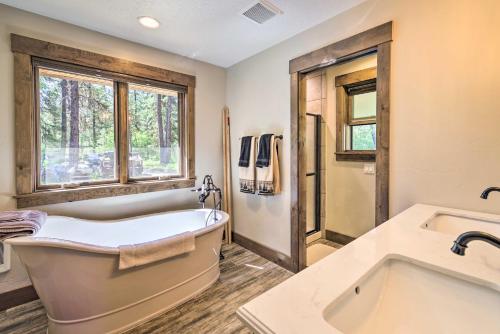 a large bathroom with a tub and a sink at Hot Tub Soaks and Spot Wildlife! Garden Valley Cabin in Crouch