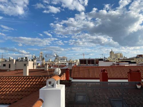 a view of a city from the roof of a building at Feelathome San Marcos Apartments in Madrid