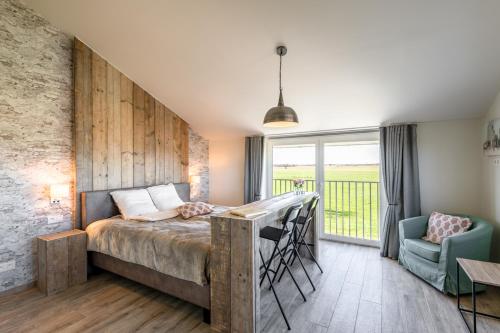 Postel nebo postele na pokoji v ubytování Bed en Vrijheid