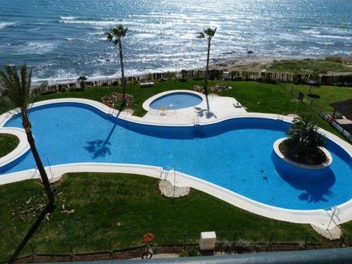 an overhead view of a swimming pool near the ocean at Mi Capricho in Sitio de Calahonda