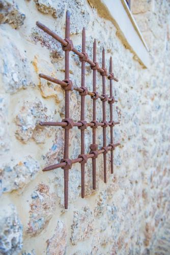 a metal fence on the side of a building at Anotopos in Ano Trikala