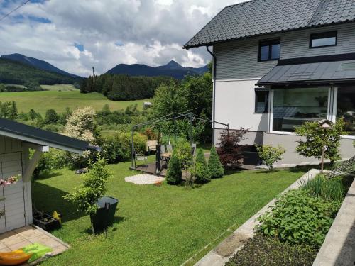a view of the backyard of a house at Ferienwohnungen Sammer in Strobl