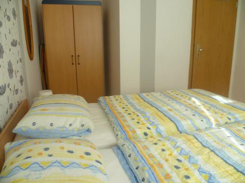 מיטה או מיטות בחדר ב-Ferienhaus 1
