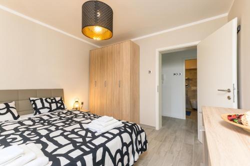 Postel nebo postele na pokoji v ubytování Apartment Pearl of Kvarner , Opatija