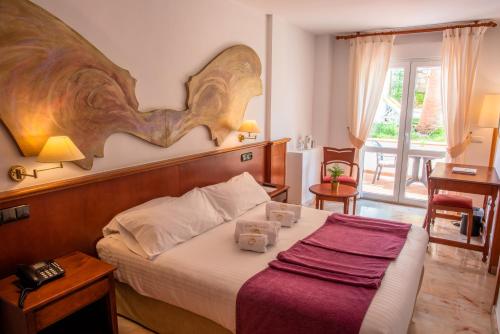 Postel nebo postele na pokoji v ubytování Villa Guadalupe