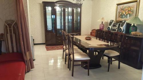 a dining room with a table and chairs at VILA PEKEČ in Mala Moštanica