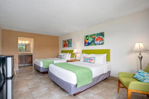 Postel nebo postele na pokoji v ubytování Park Royal Orlando