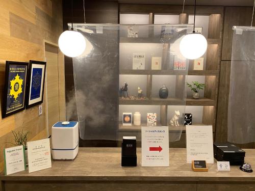 a display of items on a counter in a store at Belken Hotel Kanda in Tokyo