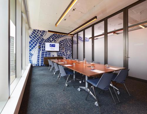 a conference room with a long table and chairs at Holiday Inn Express Melbourne Southbank by IHG in Melbourne
