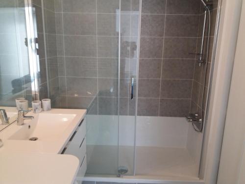 a bathroom with a shower and a sink at Park Horizon in Sainte-Maxime