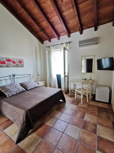 Una cama o camas en una habitación de Azienda Agrituristica Baglio Carta