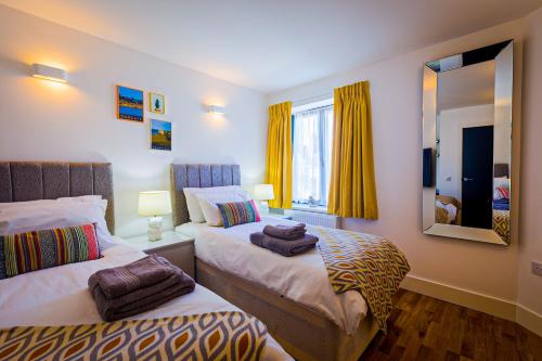 Postel nebo postele na pokoji v ubytování Broadstairs Apartments
