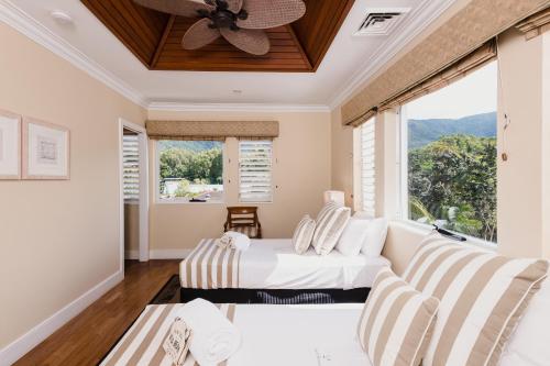 Ένα ή περισσότερα κρεβάτια σε δωμάτιο στο Villa Beach Palm Cove