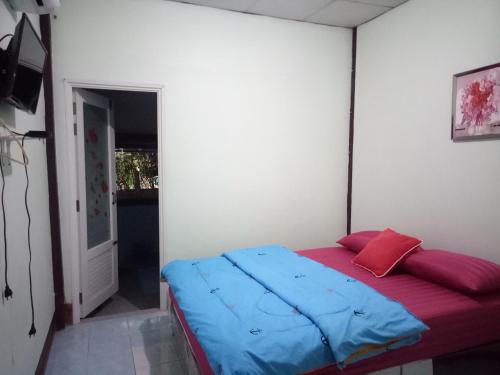 Postel nebo postele na pokoji v ubytování Baan Wang Kaew
