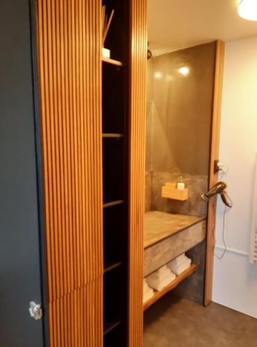 a bathroom with a walkin closet with a shower at 2Azores With Comfort and Style in Ponta Delgada