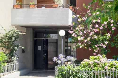 a front door of a building with flowers at YourHome in Vico in Vico Equense