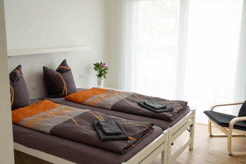 two beds sitting on top of each other in a room at Anstatthotel Horw - self-check-in in Luzern