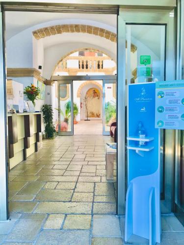 an entrance to a building with an open door at Al Pescatore Hotel & Restaurant in Gallipoli