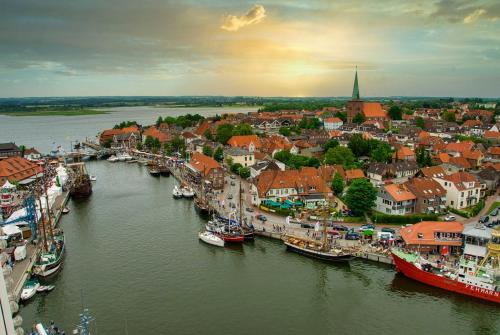 an aerial view of a city with boats in a river at Ferienwohnung _Altes Zollamt_ in Neustadt in Holstein