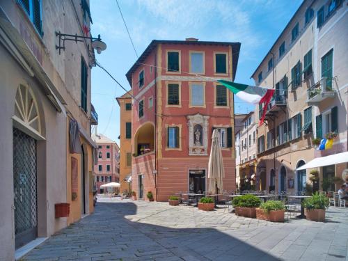 a street in an old town with buildings at 2 passi dal mare in Finale Ligure