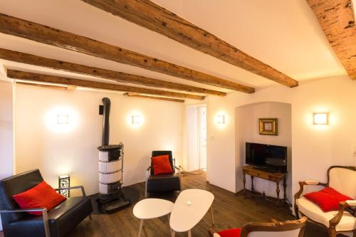 a living room with a couch and a stove at Wonderlandscape Guest House in Geneva