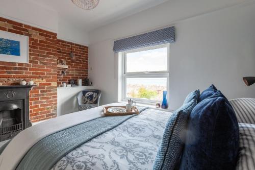A bed or beds in a room at The Caledon Guest House 
