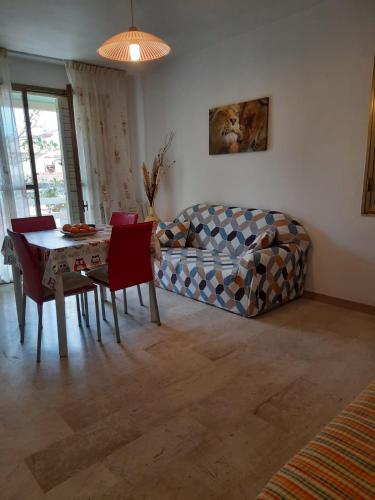 a living room with a couch and a table at Casa Vacanze Arba Girasole in Girasole
