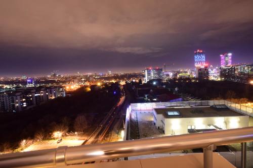 a view of a city at night with lights at Upground Residence Apartments in Bucharest