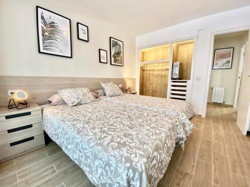 En eller flere senge i et værelse på Habitat Barcelona Apartment