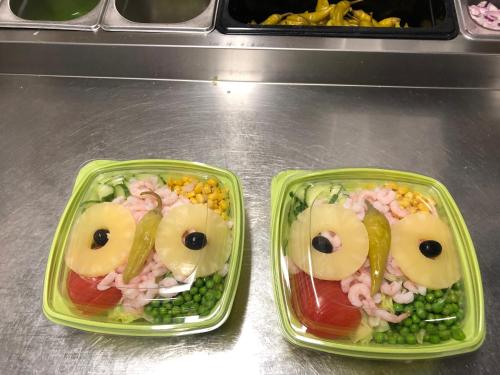 two plastic containers filled with food with eyes and peas at Värdshuset Stopet in Grängesberg