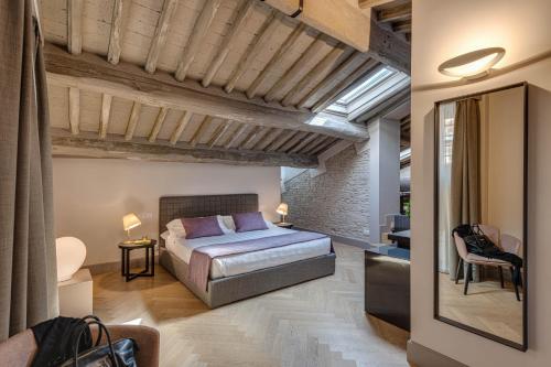 Postel nebo postele na pokoji v ubytování Palazzo Dipinto