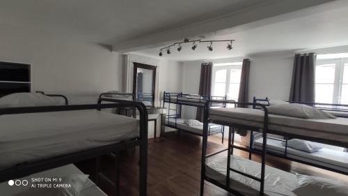 a dorm room with several bunk beds in it at Gîte Le Chemin vers l'Etoile in Saint-Jean-Pied-de-Port