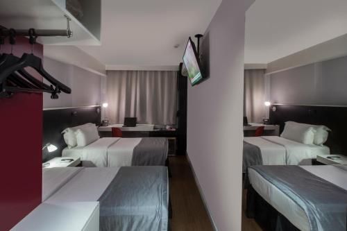 Cama ou camas em um quarto em Hotel WZ Jardins