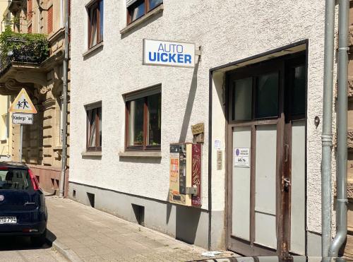 a building with a sign that reads audio ukeler on it at Traumhaftes Privatzimmer in Karlsruhe in Karlsruhe