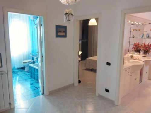 a bathroom with a sink and a toilet in a room at La Casa Bianca in Camerano