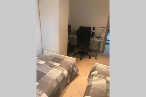 a bedroom with a bed and a desk with a computer at Bride apartment Colonno in Colonno