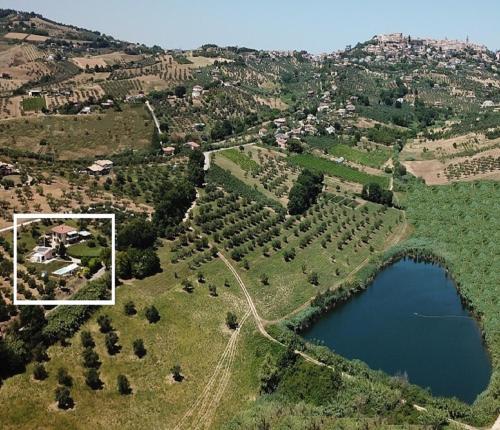 an aerial view of a lake and trees at I Tre Laghi Countryhouse 14 posti letti Cottage 10 posti letti in Citta' Sant'Angelo