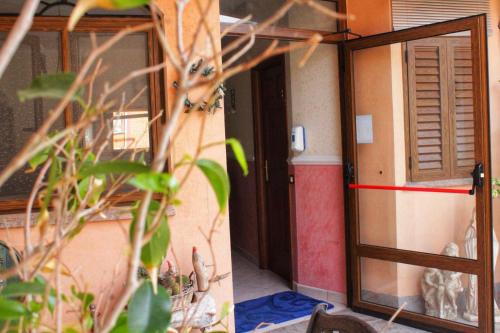 a room with a door and a window and a plant at Hotel Ristorante L'Avvenire in Gizzeria