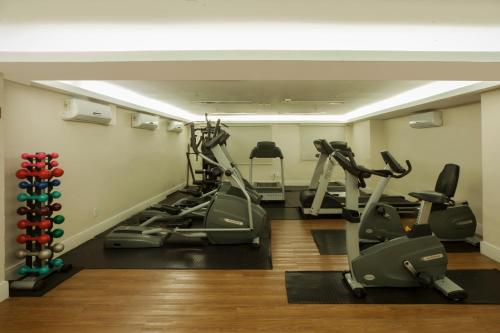 a gym with treadmills and elliptical machines at Hotel WZ Jardins in Sao Paulo