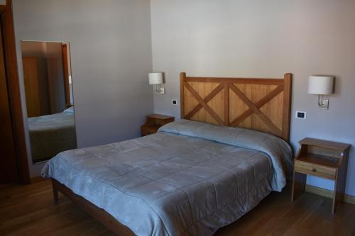 Ein Bett oder Betten in einem Zimmer der Unterkunft Lo Sciatore Hotel & Restaurant
