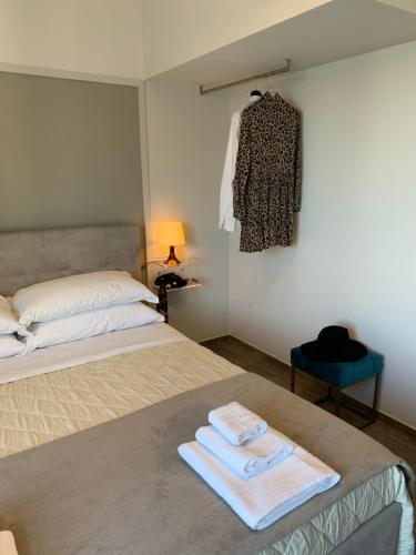 מיטה או מיטות בחדר ב-Cappellanio Suite & Apartament