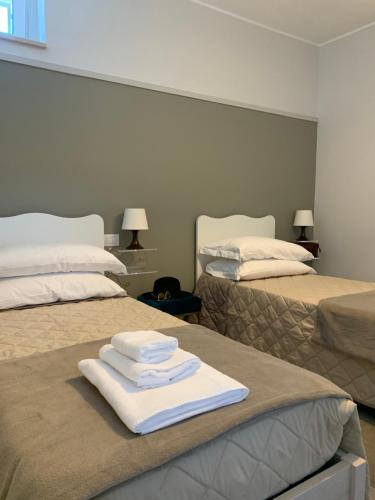 Postel nebo postele na pokoji v ubytování Cappellanio Suite & Apartament
