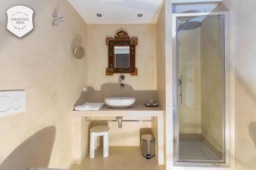 a bathroom with a sink and a shower at Granda Sweet Suites in Venice