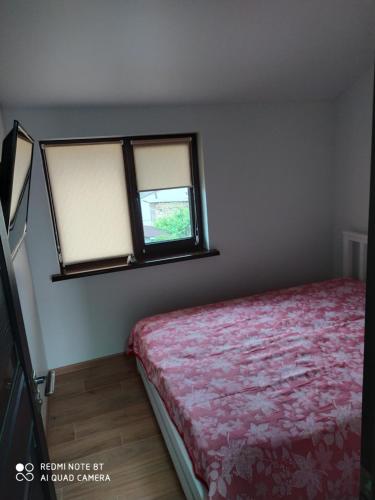 Ένα ή περισσότερα κρεβάτια σε δωμάτιο στο REEF APARTMENTS
