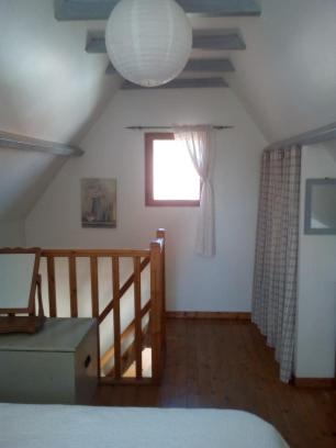 Ένα ή περισσότερα κρεβάτια σε δωμάτιο στο La Maisonnette - animaux acceptés, parking privé, jardin plein sud