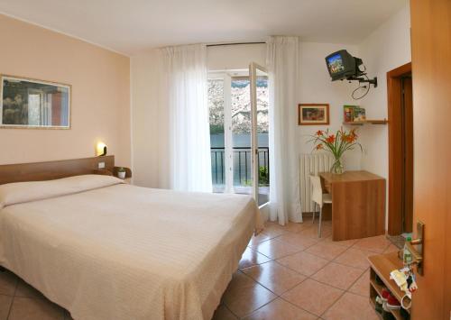 Postel nebo postele na pokoji v ubytování Hotel Baitone - Nature Village